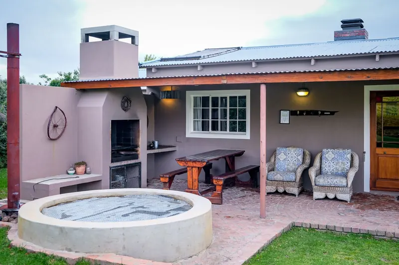 Inviting residential patio with a hot tub and comfortable seating area
